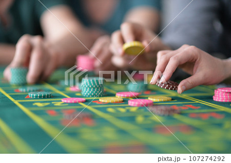 hand of the player making the bet in a casino hand of the player making the bet in a casino 107274292