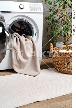 Cropped photos of bathroom interior with washing machine Cropped photos of bathroom interior with washing machine 107274389
