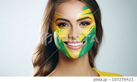 Young female with the flag of Brazil painted on her face on her way to a sporting event to show her support. 107276421