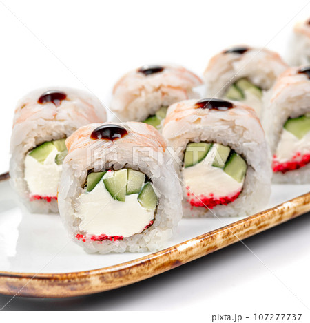 asian food - sushi roll with shrimp, cucumber and masago caviar. asian food - sushi roll with shrimp, cucumber and masago caviar. 107277737
