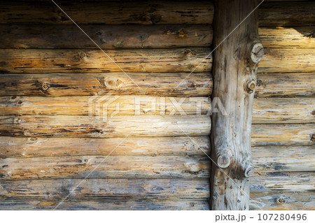 Modern Hand Hewn Natural Log Cabin Wall Facade Fragment Texture. Rustic Log Wall Horizontal Timber Background. Planed Wood 107280496