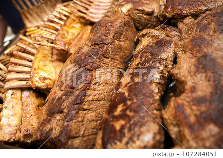 Sizzling BBQ Delight: Steak and Lamb Ribs Grill Masterpiece 107284051