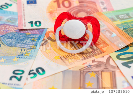 Baby Pacifier on the Euro Banknotes 107285610