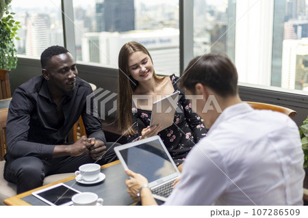 Happiness business team Colleagues talking talking and discuss in cafe during break in restaurant. 107286509