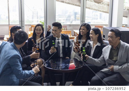 Happiness young bubiness teamwork party activity after work in restaurant. Happiness young bubiness teamwork party activity after work in restaurant. 107286952