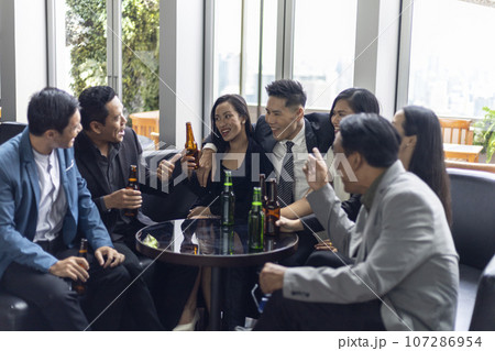 Happiness young bubiness teamwork party activity after work in restaurant. Happiness young bubiness teamwork party activity after work in restaurant. 107286954