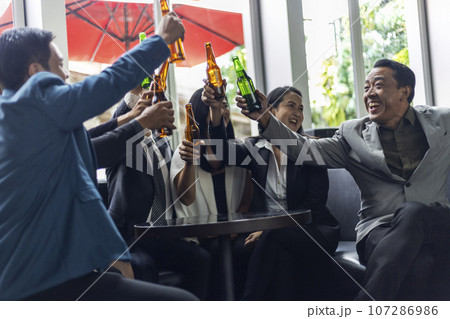 Happiness young bubiness teamwork party activity after work in restaurant. Happiness young bubiness teamwork party activity after work in restaurant. 107286986