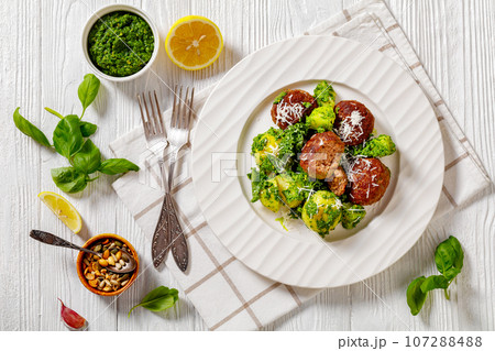 finnish beef meatballs with potatoes and pesto 107288488