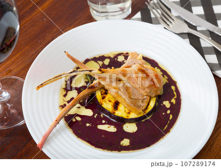Baked ribs of lamb with eggplant in wine sauce Baked ribs of lamb with eggplant in wine sauce 107289174