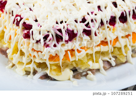 Russian dressed herring salad 107289251