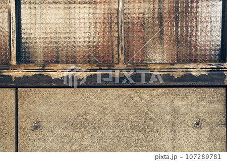 Joints in the wall between wooden boards. Background texture. Textured MDF sheet, abstract background. Texture of the reverse side of the fiberboard sheet. High quality photo 107289781
