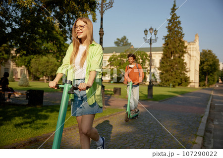 Company of students using electric scooter vehicles Company of students using electric scooter vehicles 107290022