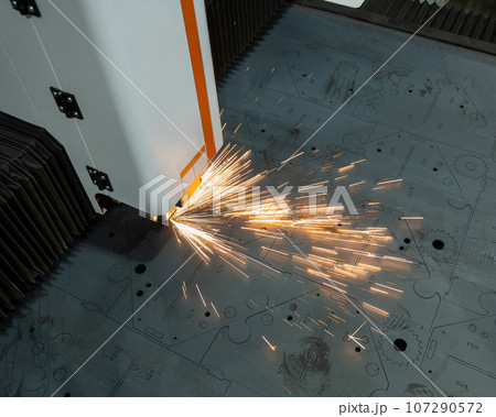 CNC machine. Laser cutting of metal. Sparks. CNC machine. Laser cutting of metal. Sparks. 107290572