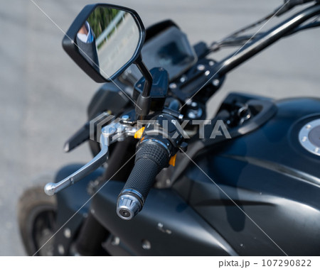 Dashboard of a parked electric motorcycle.  107290822