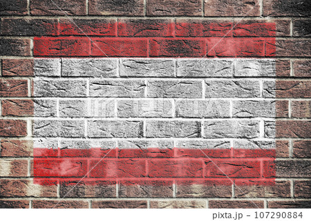 Tahiti flag on a brick wall background 107290884