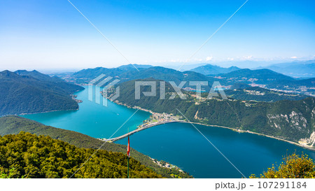 Lugano Lake, Italian: Lago di Lugano. Lookout from Balcony of Italy on Mount Sighignola. Italy and Switzerland Lugano Lake, Italian: Lago di Lugano. Lookout from Balcony of Italy on Mount Sighignola. Italy and Switzerland 107291184