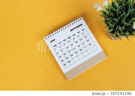 September 2024 desk calendar on yellow background. Directly above. Flat lay. 107291296