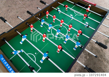view of the football field and plastic players at a football match view of the football field and plastic players at a football match 107291404
