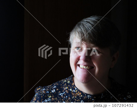 A middle aged lady looking off camera A middle aged lady looking off camera 107291432