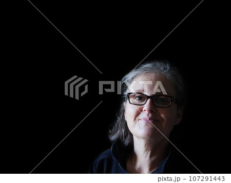 A beautiful middle aged lady posing for the camera 107291443