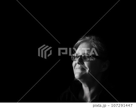 A beautiful middle aged lady posing for the camera 107291447