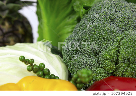 Vegetarian and vegan healthy lifestyle concept. Raw vegetables and fruits with empty plate over rustic background 107294925