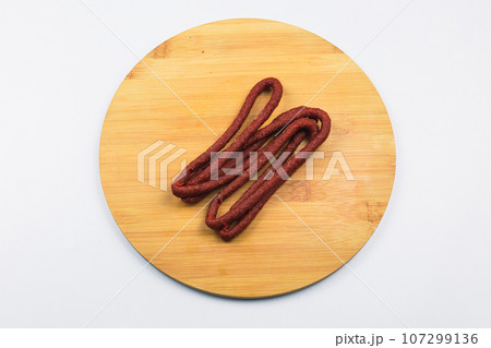 Delicious dried red meat sausages. 107299136