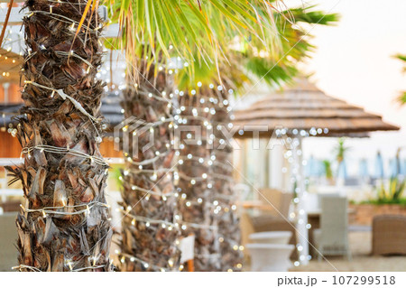 Parasol umbrella on tropical island beach. Colourful sunshade in the beach on sunny summer day. Holiday relaxation with turquoise sea and blue sky landscape 107299518