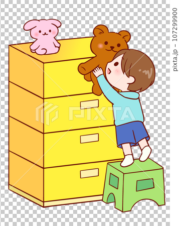 一個男孩用一個架子從抽屜櫃拿起一個毛絨動物。 一個男孩用一個架子從抽屜櫃拿起一個毛絨動物。 107299900