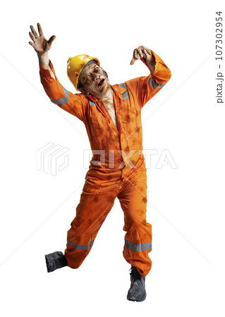A scary construction worker zombie with blood and wounds on his body walking 107302954