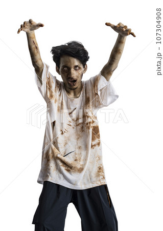 A scary zombie with blood and wounds on his body walking 107304908