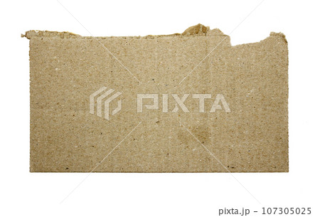 A sheet of corrugated paper is torn into pieces isolated on white background 107305025