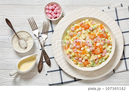 Ambrosia Salad in white bowl, top view 107305182