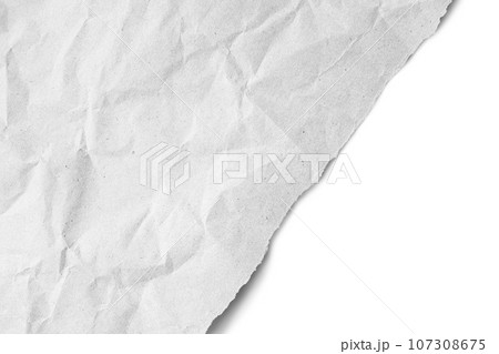 Recycled crumpled white paper texture with a diagonal torn edge isolated on white background 107308675
