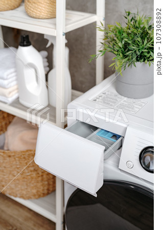 Cropped photos of bathroom interior with washing machine 107308892