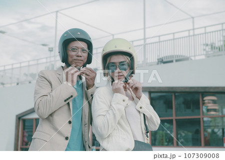 portrait of asian couples wearing safety helmet on city street 107309008