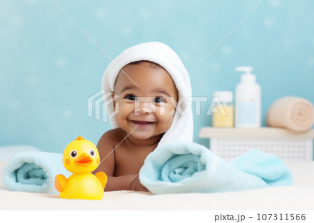 Happy African-American little baby wearing white hooded towel sitting on the bed after bath, Generative Ai 107311566