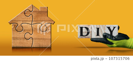 Wooden House Formed from Jigsaw Puzzle Pieces and Text Diy 107315706