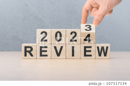 Review 2024. hand flips wooden cube and changes words REVIEW 2023 to REVIEW 2024. New year 2024. Economy and business. Phrase 2024 review. Review 2024. hand flips wooden cube and changes words REVIEW 2023 to REVIEW 2024. New year 2024. Economy and business. Phrase 2024 review. 107317134