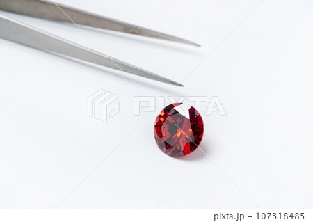 Red Ruby gemstone Round Cut isolate on white background, close up shot 107318485