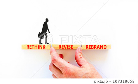 Rethink revise rebrand symbol. Concept word Rethink Revise Rebrand on beautiful block. Beautiful white table white background. Business brand motivational rethink revise rebrand concept. Copy space. Rethink revise rebrand symbol. Concept word Rethink Revise Rebrand on beautiful block. Beautiful white table white background. Business brand motivational rethink revise rebrand concept. Copy space. 107319658