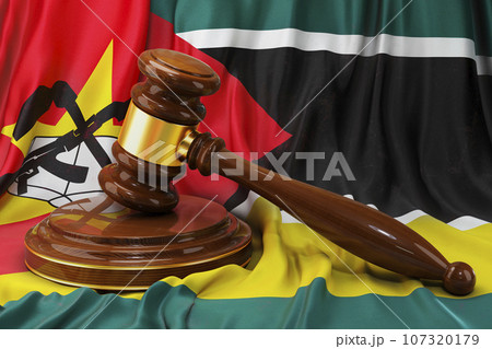 Mozambican law and justice concept. Wooden gavel on flag of Mozambique, 3D rendering 107320179