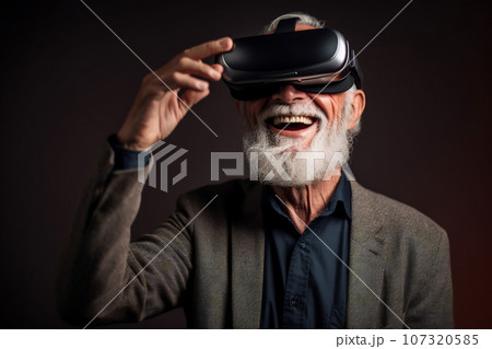 Senior man having fun with virtual reality glasses. Old people using new headset goggles trends technology Senior man having fun with virtual reality glasses. Old people using new headset goggles trends technology 107320585