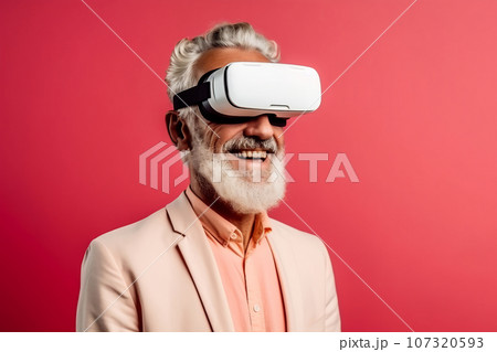 Senior man having fun with virtual reality glasses. Old people using new headset goggles trends technology 107320593