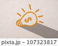 Abstract orange thinking light bulb on concrete wall background 107323817