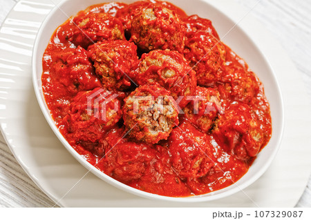 Iowa Ham Balls with tomato sauce in bowl 107329087