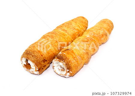 Puff cream Rolls on white background with selective focus Puff cream Rolls on white background with selective focus 107329974