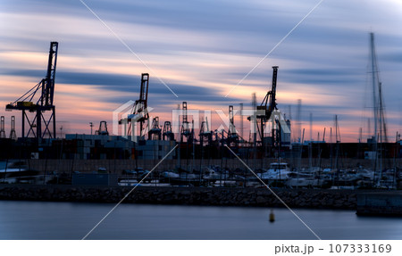 Captivating Long Exposure of Commercial and Sports Docks at Dusk Captivating Long Exposure of Commercial and Sports Docks at Dusk 107333169