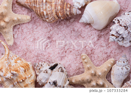 aromatic pink Himalayan sea salt texture background and fish star. Homemade Herbal bath salts. Skincare spa beauty bath cosmetic products for relax. Natural skin care. Top view, copy space. Home spa. 107333284