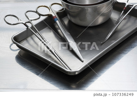 Used surgical instruments on a stainless tray 107336249